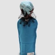 A person wearing a blue hat and holding something