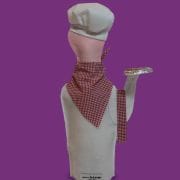 A mannequin wearing a chef 's hat and holding a tray.